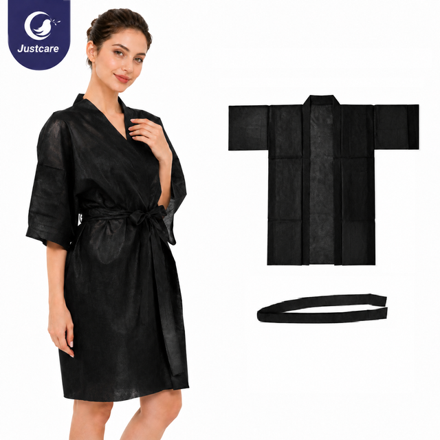 Kimono negro no tejido desechable con mangas cortas para spa y sal&oacute;n