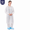 Justcare Velcro‑fastened disposable lab coat, white non‑woven protective lab coat on model, plain white background