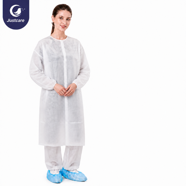 Justcare Velcro‑fastened disposable lab coat, white non‑woven protective lab coat on model, plain white background