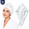 Justcare disposable non woven hair drying cap worn by woman, quick absorbent hair wrap cap, white background lifestyle image