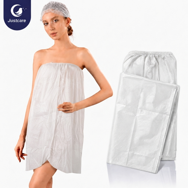 Justcare disposable spunlace bath gown worn by model, folded disposable spa wrap skirt display