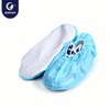 Justcare disposable shoe covers with dot non‑slip sole, light blue PP shoe covers with white anti‑slip sole, pair of shoe covers on white background